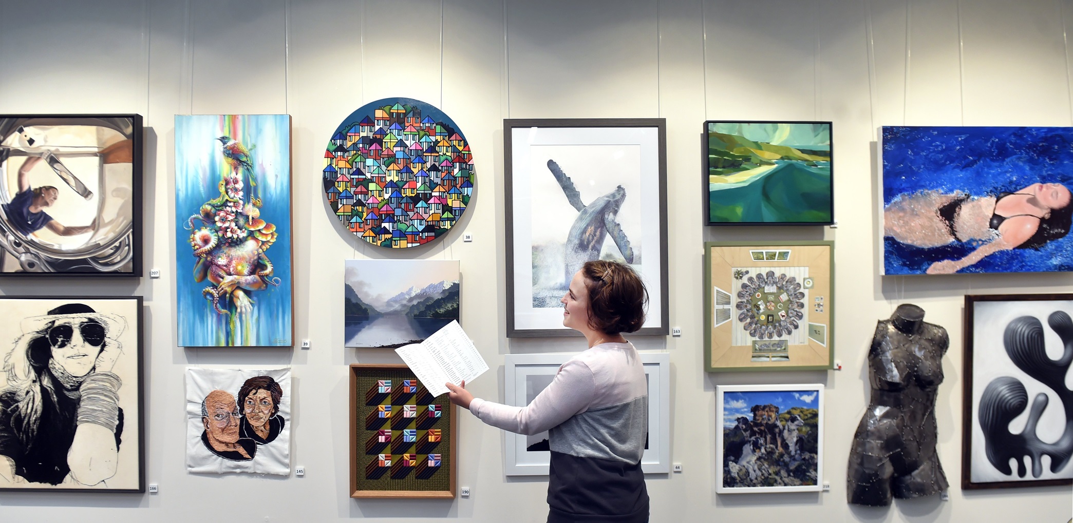 Aislinn Roodt, of Dunedin, admires some of the artworks on display at the Cleveland National Art...