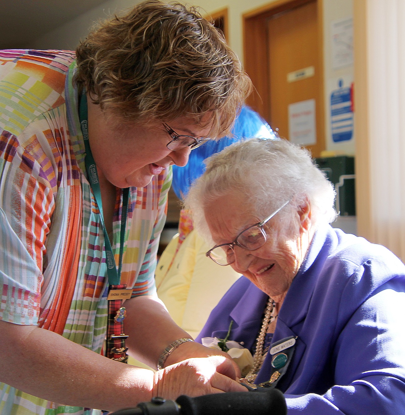 June Waters (right) accepts a mighty 70-year service award from the South Otago Federation of...