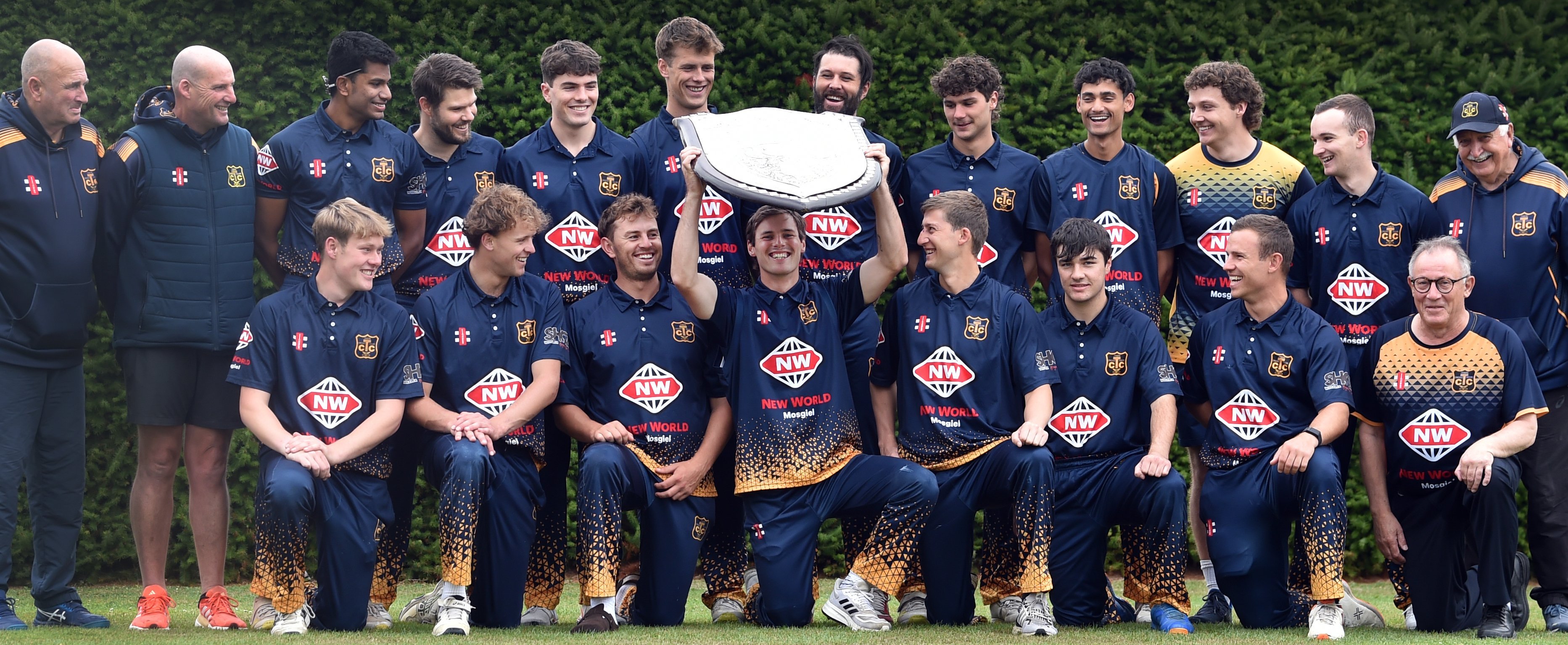 Taieri captain Beckham Wheeler-Greenall hoists the Bing Harris Shield as he and his team-mates...