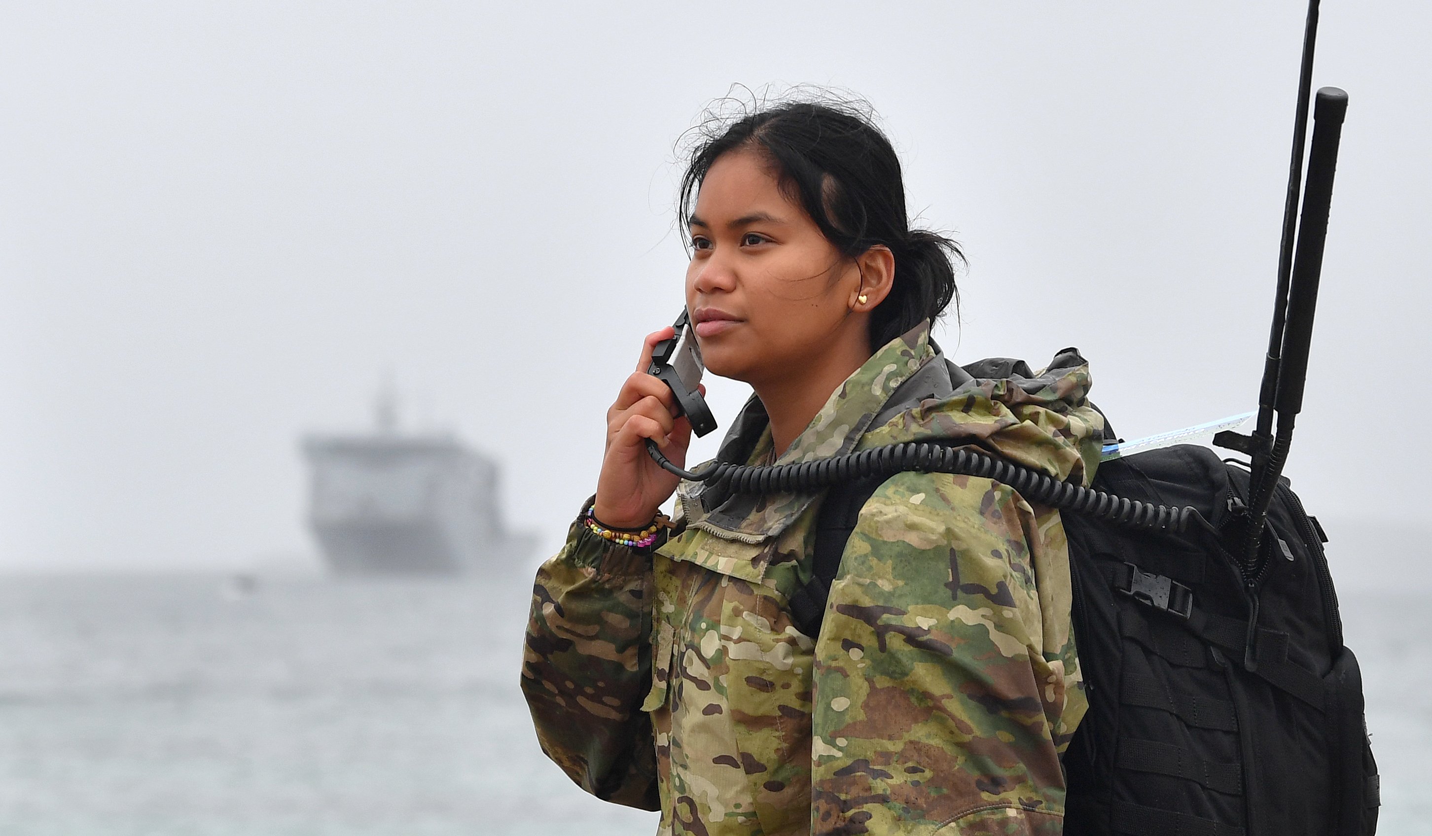 Kae Castillo, an army signaller, checks radio reception from Enderby Island.