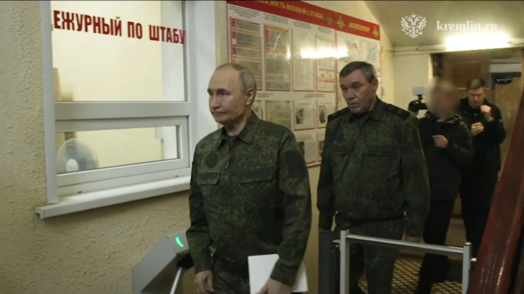 A screen grab from a video shows Russian President Vladimir Putin, dressed in military uniform,...