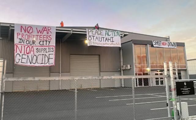 Protest banners in Rolleston. Photo: Supplied / peace.action.otautahi