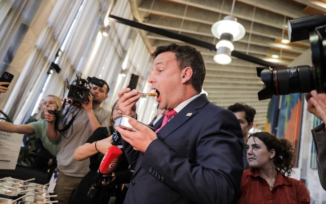 David Seymour samples one of his $3 school lunches. Photo: RNZ