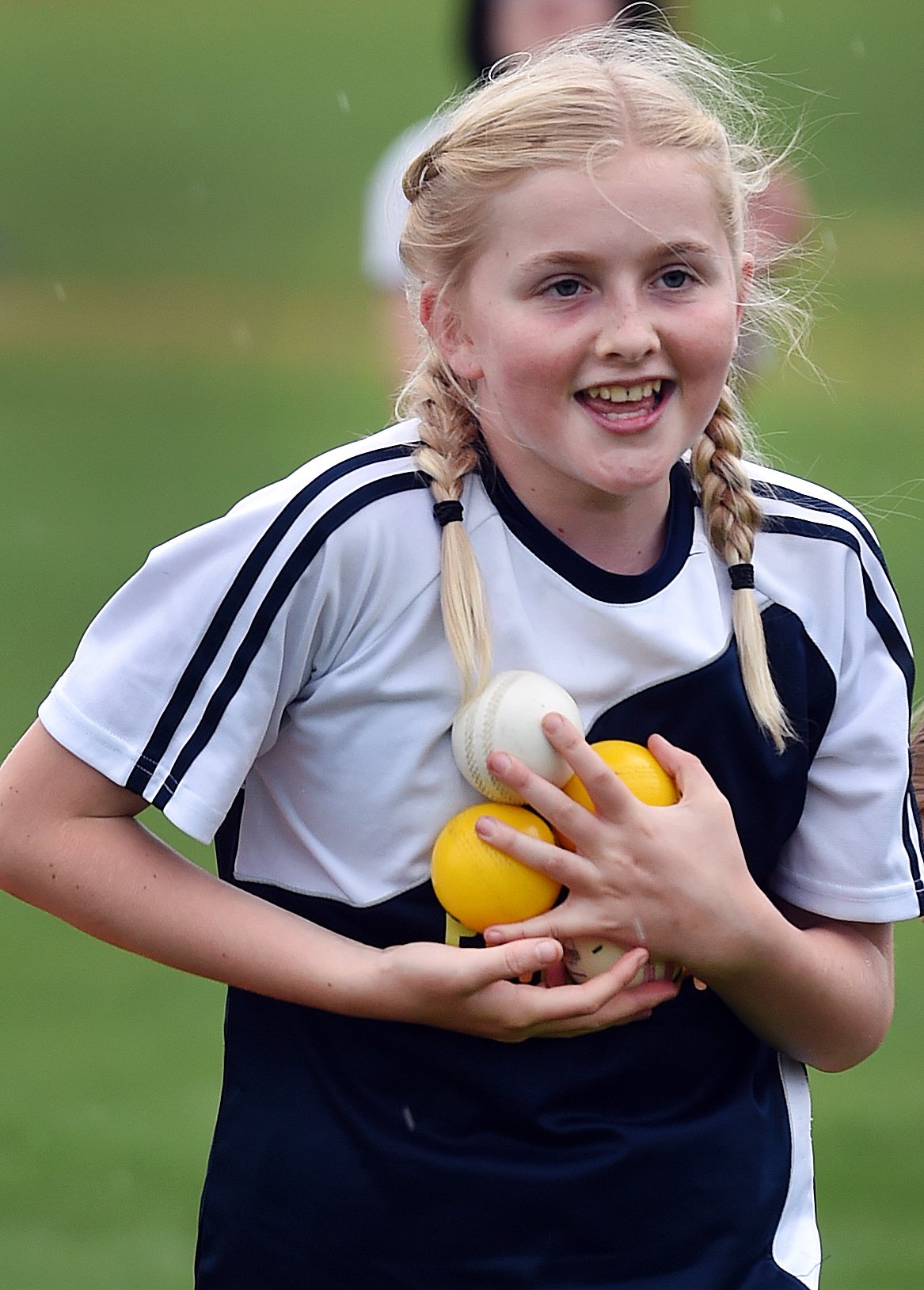 Tahuna Intermediate pupils Ava Boulger, 11, collects balls.