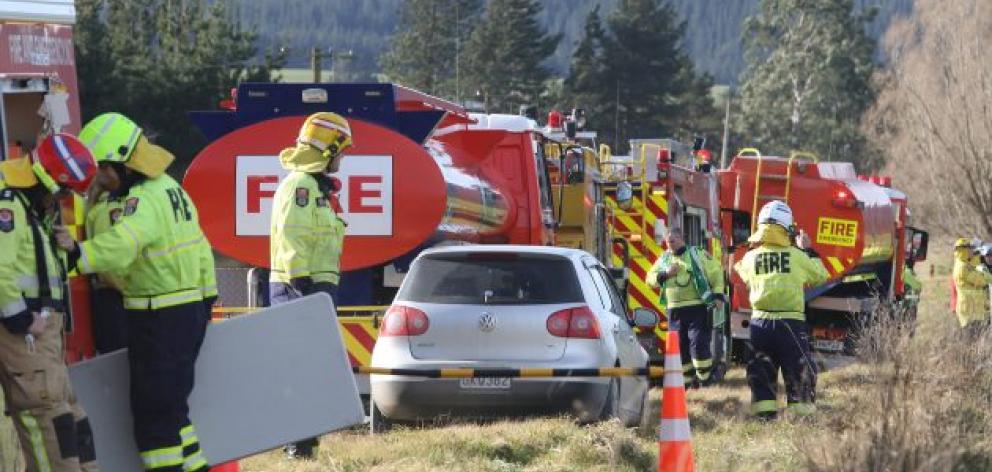 Firefighters at the scene on Monday. PHOTO: JOHN COSGROVE