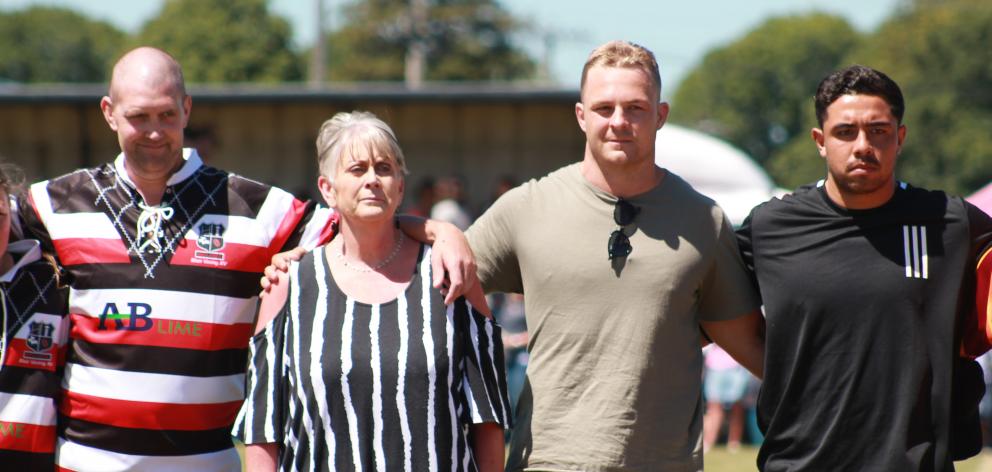 Blair Vining lines up for the national anthem with his mother Pauline and All Blacks players ...
