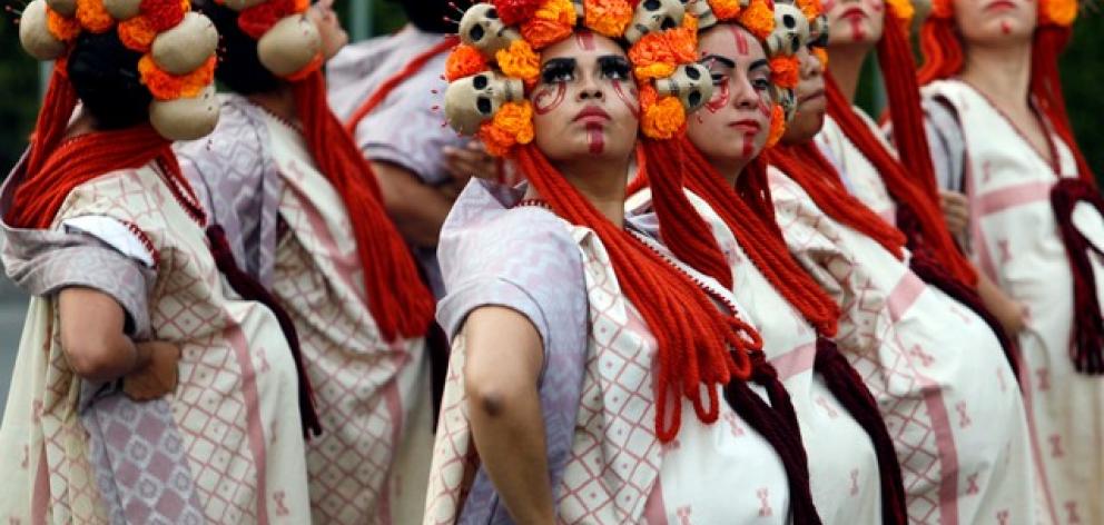 Women dressed up as "Catrinas", a Mexican character also known as "The Elegant Death", Photo: Reuters