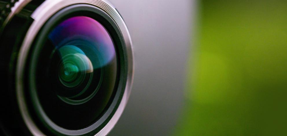 Ginae Woods set up two cameras to film a young woman in her home. Photo: Getty Images / File