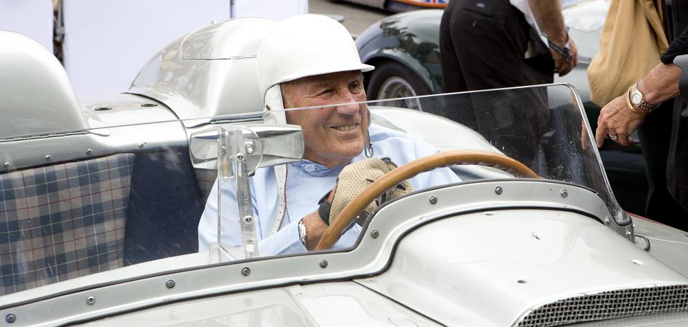 Sir Stirling Moss in the 1955 Mille Miglia winning Mercedes Benz 300 SLR at the Goodwood Festival...