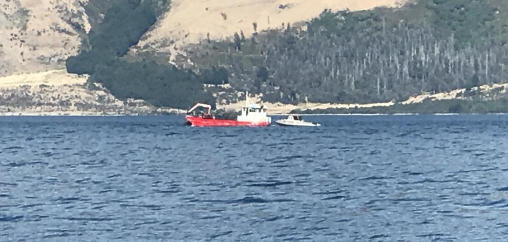 The dive squad is operating from this barge at the Jack's Pt area of Lake Wakatipu. Photo: Mandy...