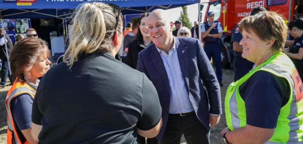 Christopher Luxon meets with emergency services and locals on the Port Hills. Photo: RNZ / Nathan...