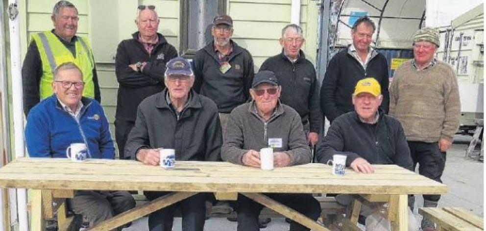 rying out the new picnic tables are (front from left) John Driscoll (Ashburton Rotary), Roger...