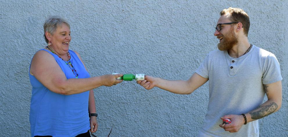 Maggie Garden and her son Chris Millar pull a Christmas cracker in St Clair.PHOTOS: SHAWN...