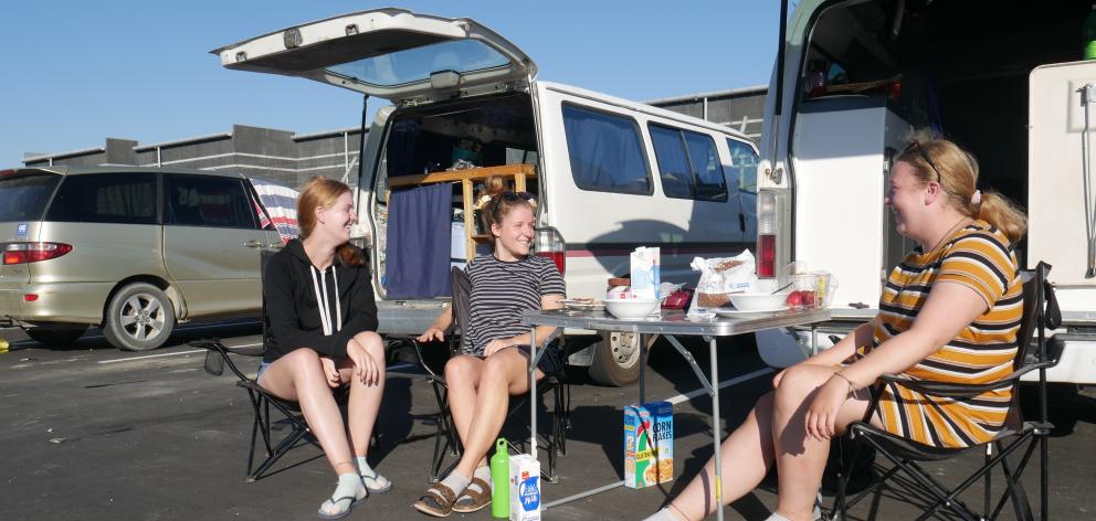 Freedom campers (from left) Janice Lohs, Anne Schmautz and Christin Firchow eat their breakfast...