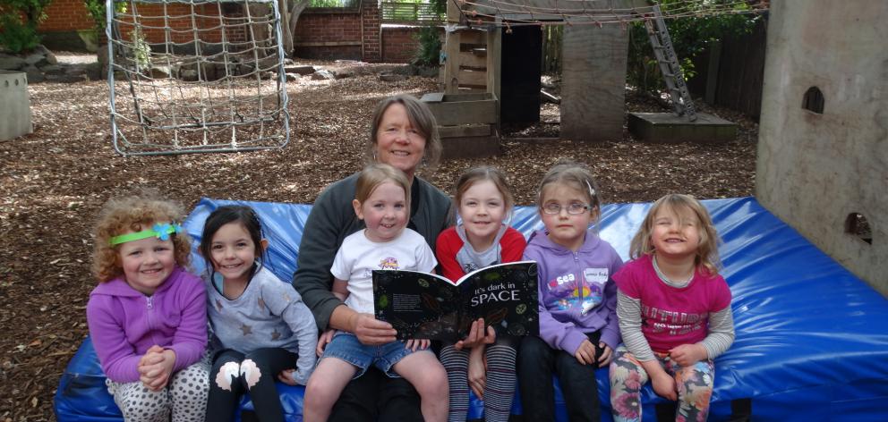 Dunedin artist Rod Eales (centre) and young artists at Early Childhood on Stafford (from left)...