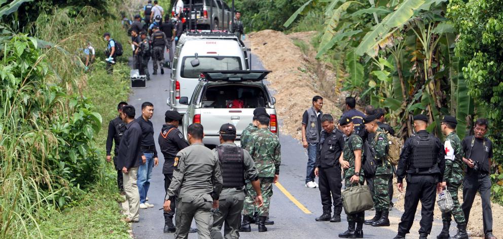 Military personnel inspected a site of the attack at Rueso district. Photo: Reuters