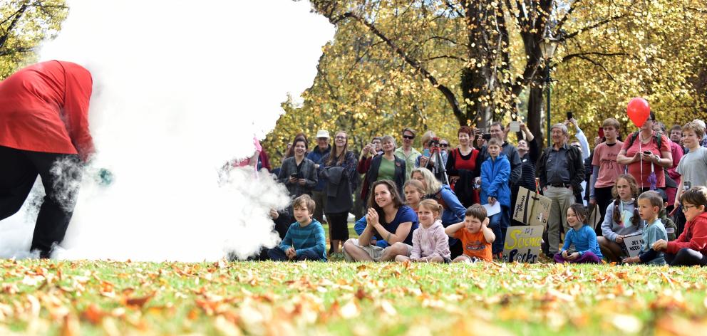 More than 200 people watch as science communicator Amadeo Enriquez-Ballestero creates a "storm'' using liquid nitrogen and boiling water at the Dunedin March for Science on the Museum Reserve on Saturday. Photo: Peter McIntosh.