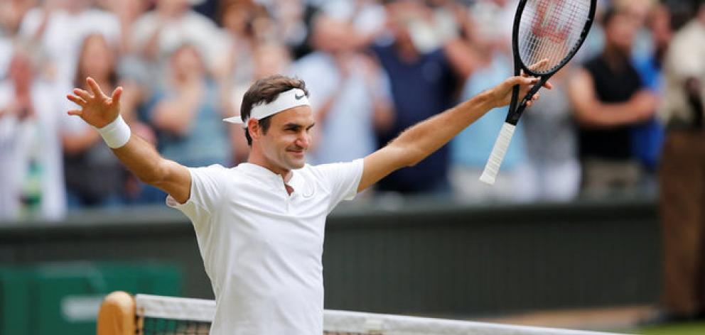 Switzerland’s Roger Federer celebrates winning the semi final match against Czech Republic’s...