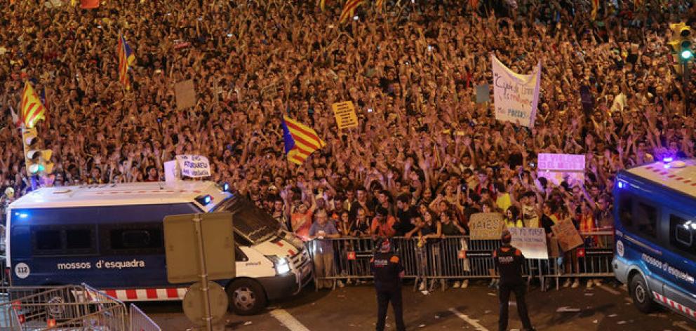 Tens of thousands of Catalans demonstrated in the streets of the northeastern region against action by the police who tried to disrupt Sunday's vote by firing rubber bullets and charging into crowds. Photo: Reuters