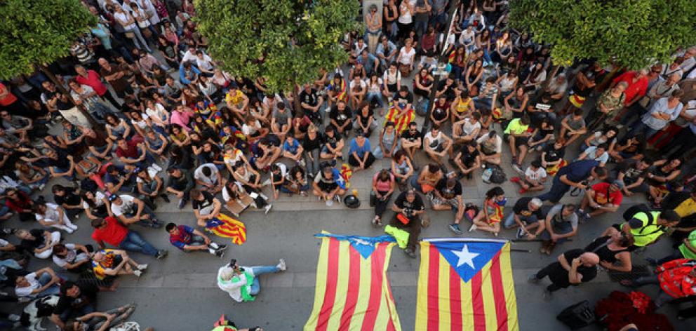 People gather during a protest against police actions during the banned independence referendum. Photo: Reuters