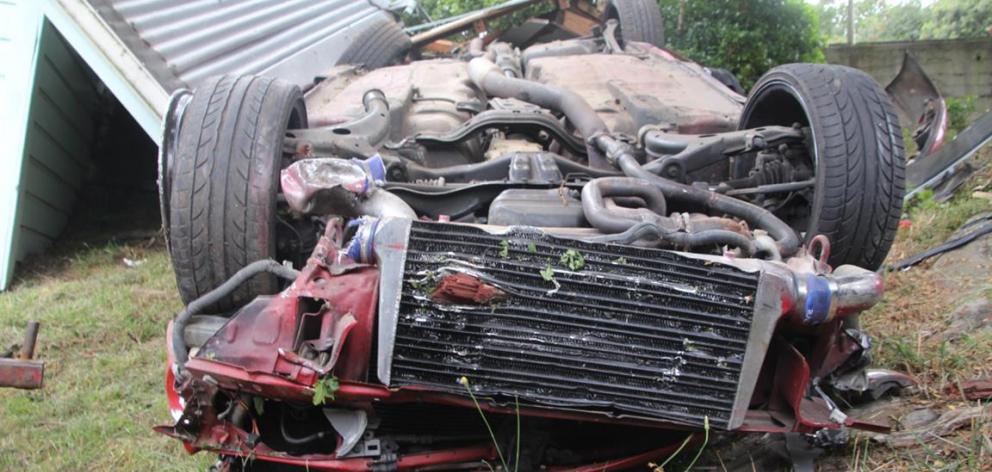 The Subaru Impreza where it lay overturned after the crash. 