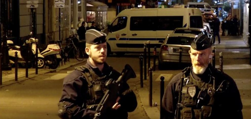 Police guard the scene of a knife attack in Paris. Photo: Reuters