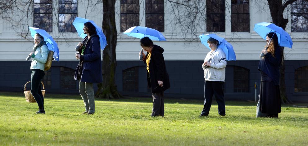 Artist Vicki Smith (far left) took people on a Sounding Walks tour through a ‘‘Wi-Fiocean’’ ...