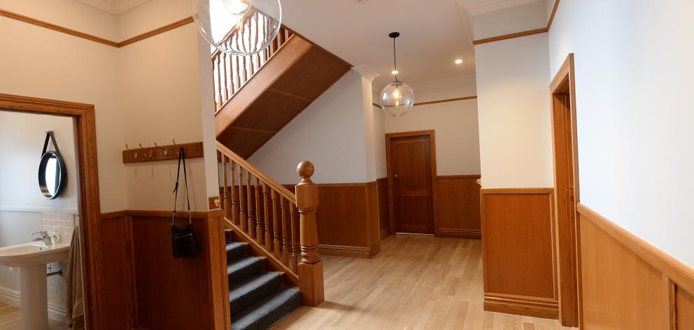 The stairs, panelling and oak flooring in the hall were added by previous owners in the early 2000s.