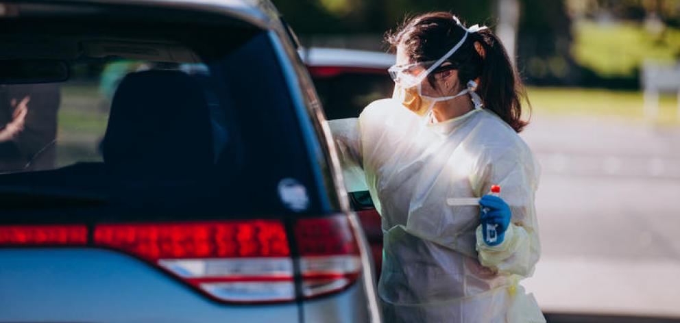 A health worker conducts a Covid-19 test. Photo: RNZ 