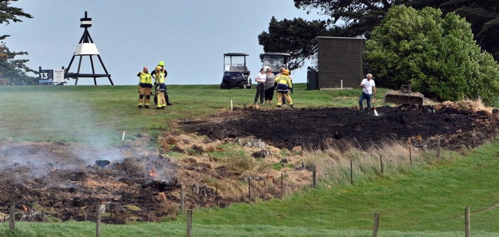 Firefighters at the St Clair Golf Course, in Hillhead Rd, yesterday.
