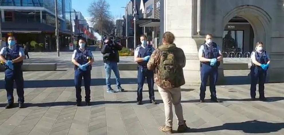Police spoke to anti-lockdown protesters in central Christchurch yesterday. Photo: RNZ 