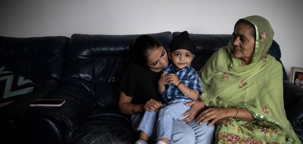 Harbaaz with his mother and grandmother at home in Christchurch. Photo: George Heard