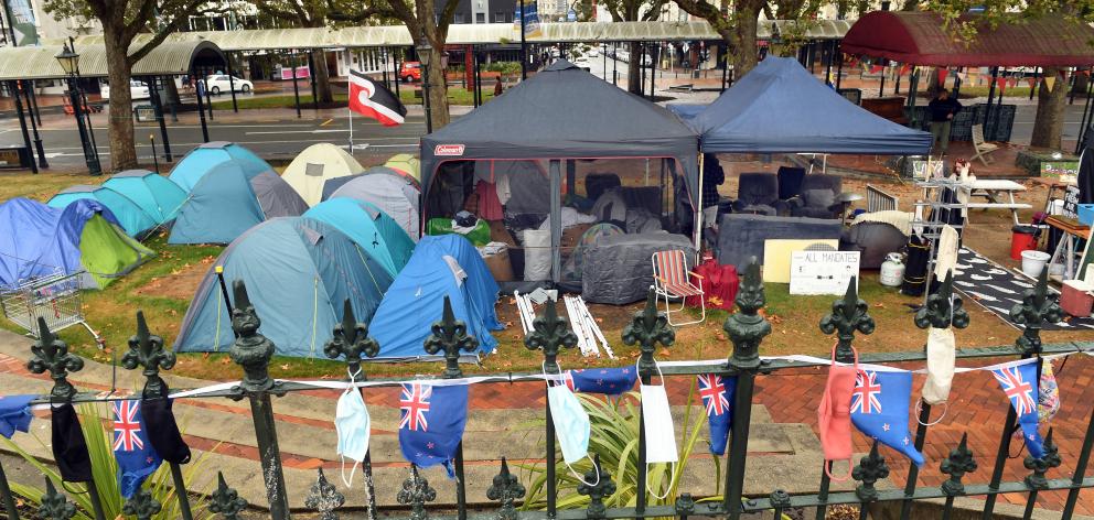 The Octagon occupation, comprising 13 dome tents, a central gazebo housing an open fire, toilet...