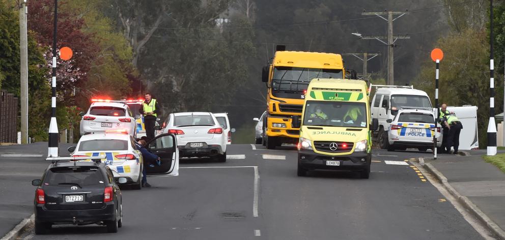 Emergency services at the scene where a pedestrian was hit by a truck in Dunedin yesterday. PHOTO...