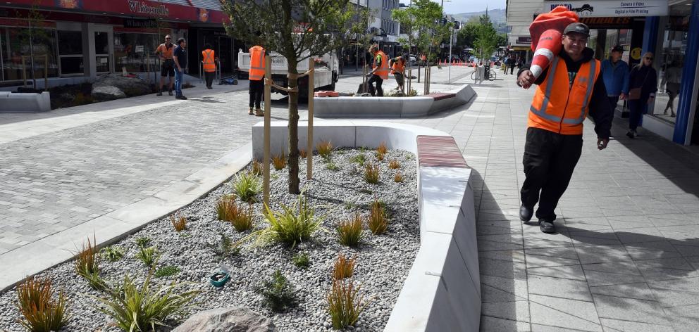 The pedestrian-oriented Farmers block features seating areas, garden beds and slow-speed one-way...