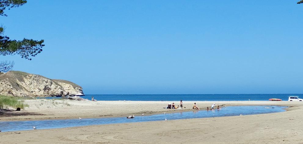 The lagoon meets the sea at Waikouaiti Beach.