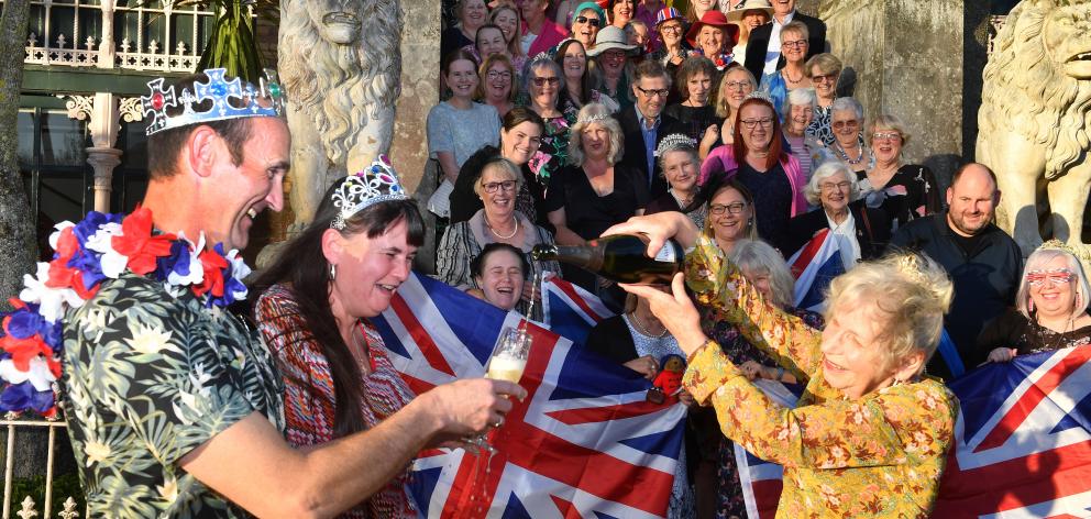 Larnach Castle owner Margaret Barker pours some bubbles for Liam and Jacqueline Sparrow during a...