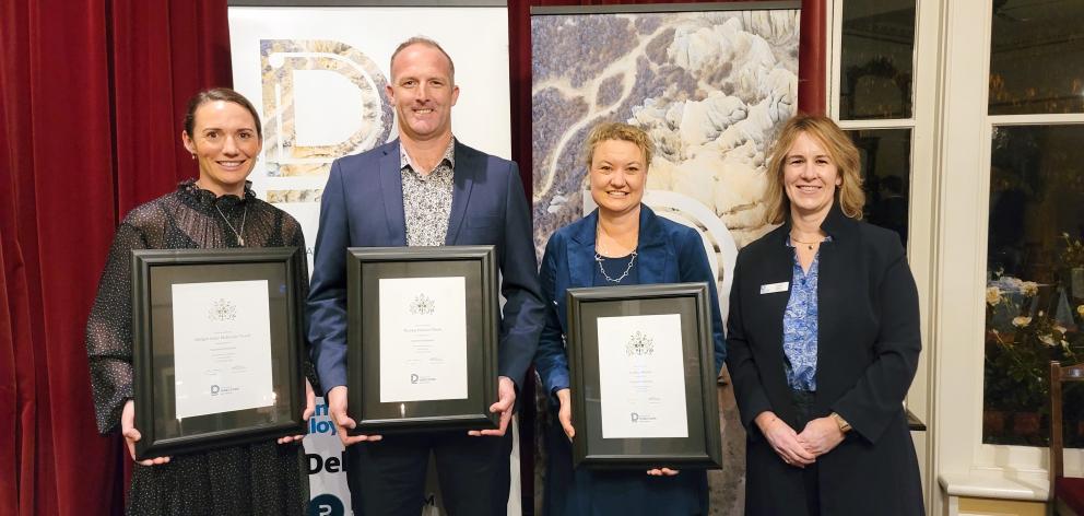 Bridget Tweed (left), Frank O’Boyle and Larissa Brown after being presented with their chartered...