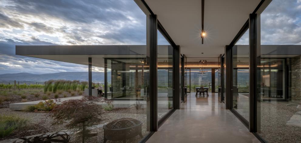 A glazed hallway connects the two pavilions.