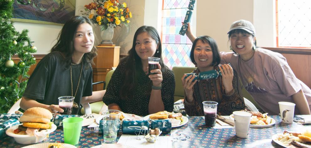 Enjoying themselves at the Alexandra community Christmas Day barbecue lunch are orchard workers ...