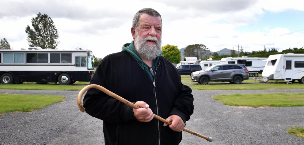 Craig Reeves, who lives in the bus at left, has received an eviction letter, telling him and...