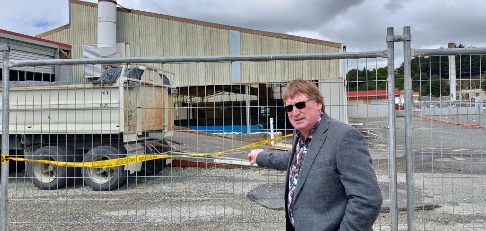 Mataura ward councillor Neville Phillips checks on the progress being made to demolish the former...