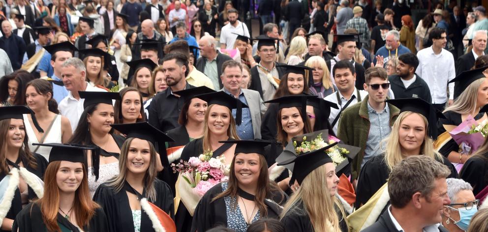 A previous University of Otago graduation parade makes its way along George St. PHOTO: PETER...