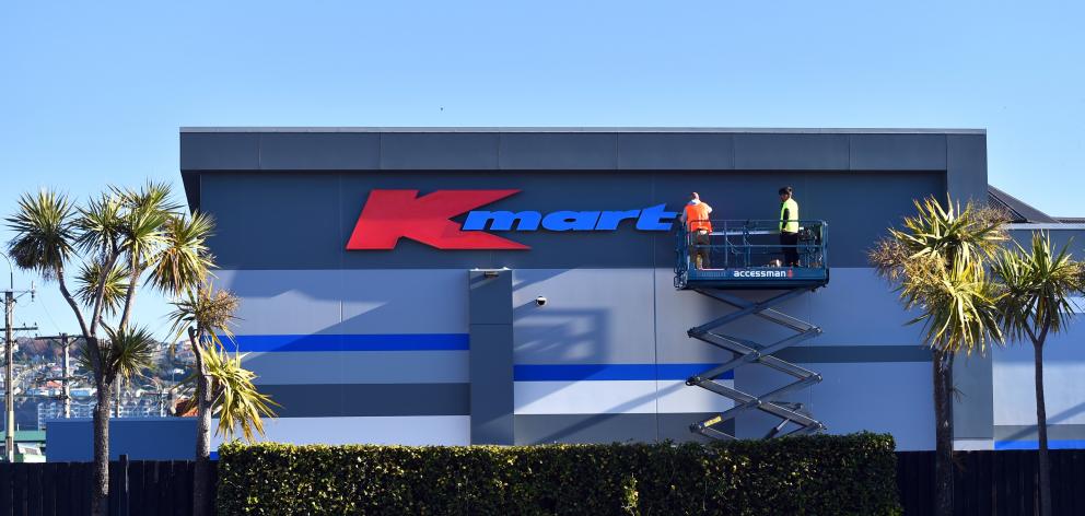 Workers put up a Kmart sign at the new site in South Dunedin. PHOTO: GREGOR RICHARDSON