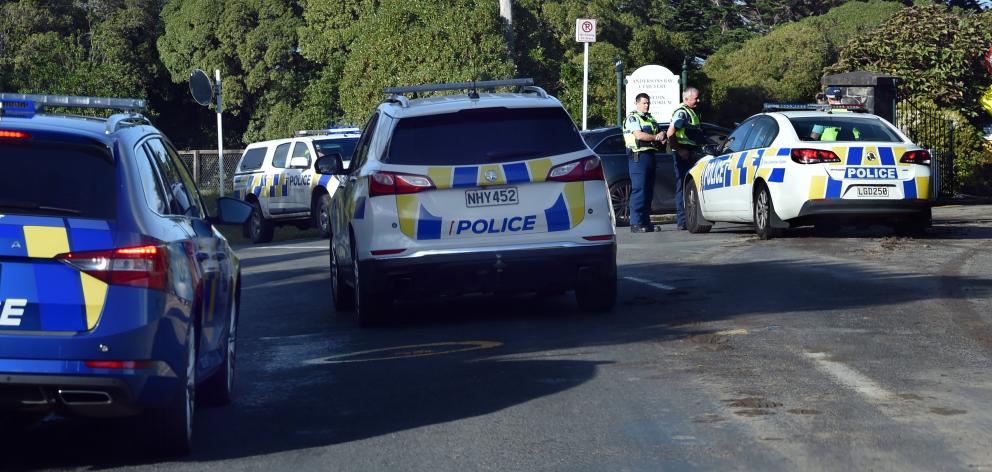Police at the entrance of the Andersons Bay Cemetery on Tomahawk Rd this afternoon. Photo: Peter...