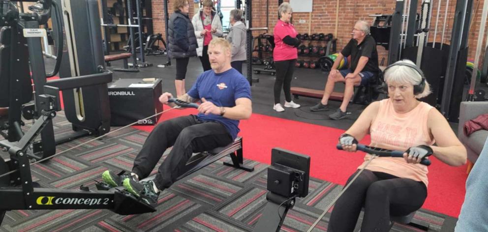 Gym owner Shane Johnstone and gym member Carol Monk sweat a little for a good cause. PHOTO: SUPPLIED
