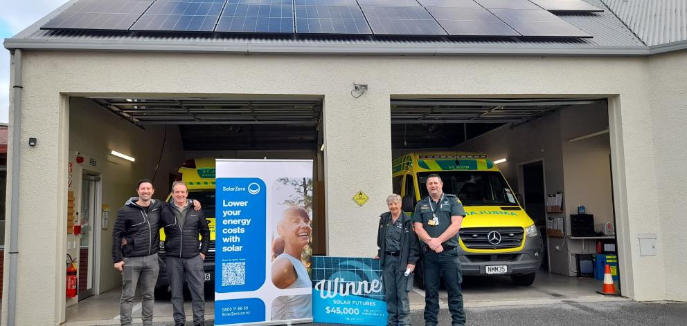 Celebrating the installation of solar panels at St John in Wānaka are, from left, Scott Kiddey,...