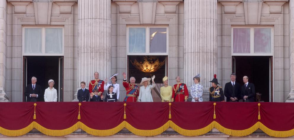 King Charles and Queen Camilla (centre) with members of the royal family on the balcony at...
