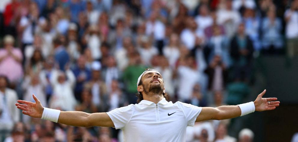 Lorenzo Musetti celebrates after winning his quarter final match against Taylor Fritz. Photo:...