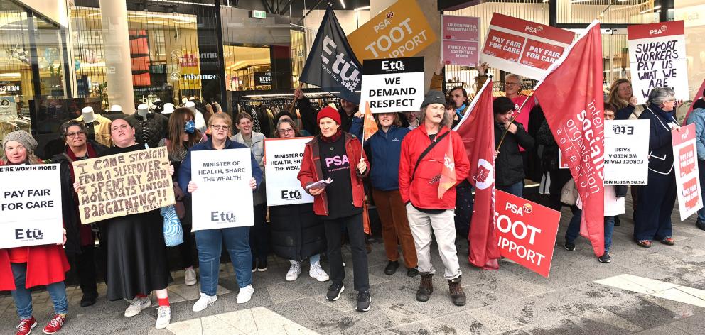 Care and support workers rally outside Dunedin’s Meridian Mall yesterday as part of a pay equity...